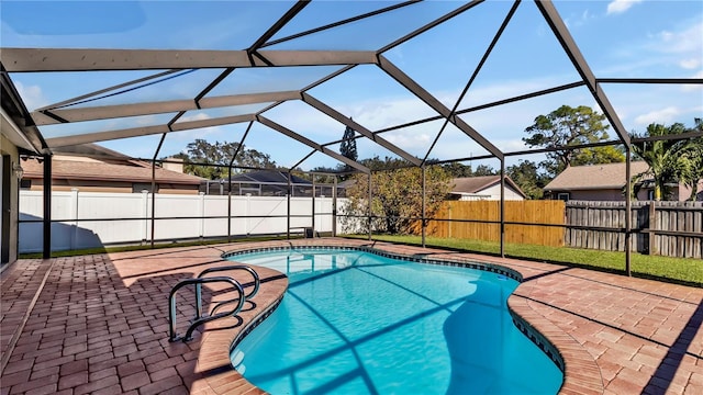 view of pool featuring a lanai and a patio area