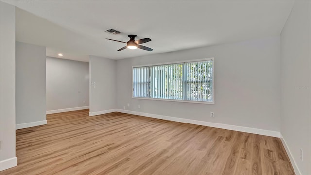 unfurnished room featuring ceiling fan and light hardwood / wood-style floors