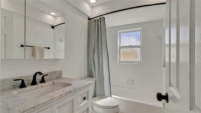 full bathroom featuring shower / bath combination with curtain, vanity, and toilet