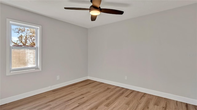 unfurnished room with ceiling fan and light wood-type flooring