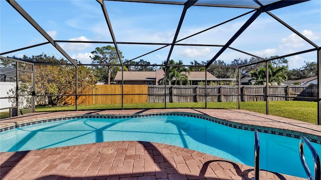 view of swimming pool featuring glass enclosure, a patio area, and a yard