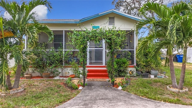 view of front of home with a front lawn