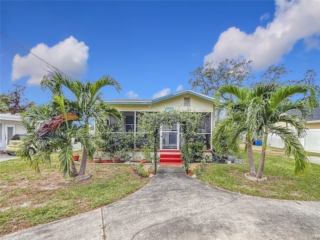 view of front of property with a front lawn