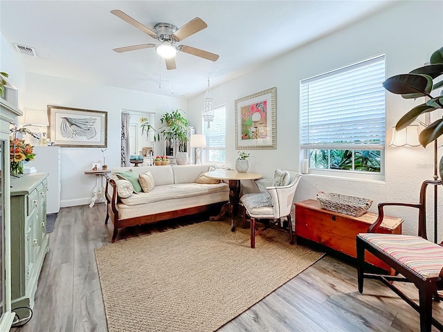 living area featuring ceiling fan and hardwood / wood-style floors