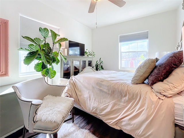 bedroom featuring hardwood / wood-style flooring and ceiling fan