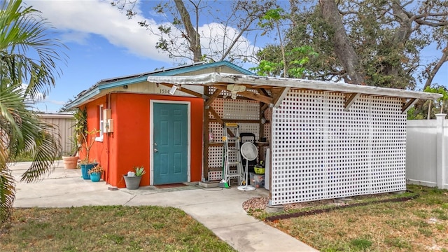 view of outbuilding featuring a lawn