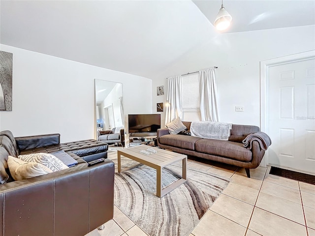 tiled living room featuring vaulted ceiling