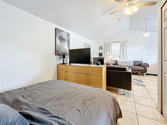 tiled bedroom featuring ceiling fan and vaulted ceiling