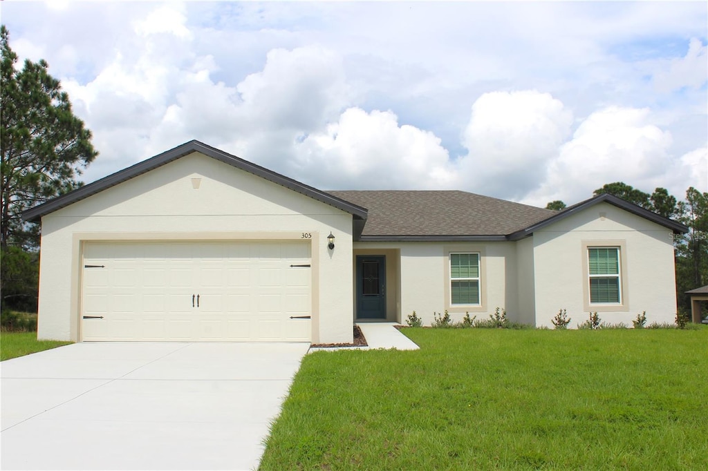 ranch-style home featuring a front yard and a garage