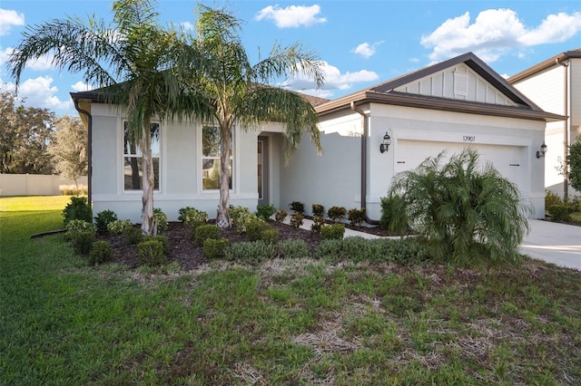 view of front facade featuring a garage and a front yard