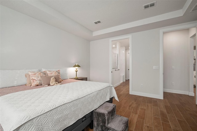 bedroom with dark hardwood / wood-style floors