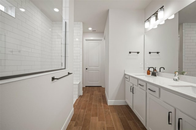 bathroom with vanity and hardwood / wood-style flooring