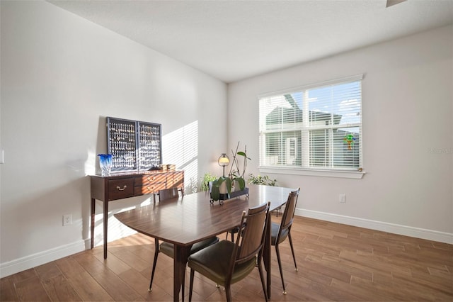 dining space featuring hardwood / wood-style flooring