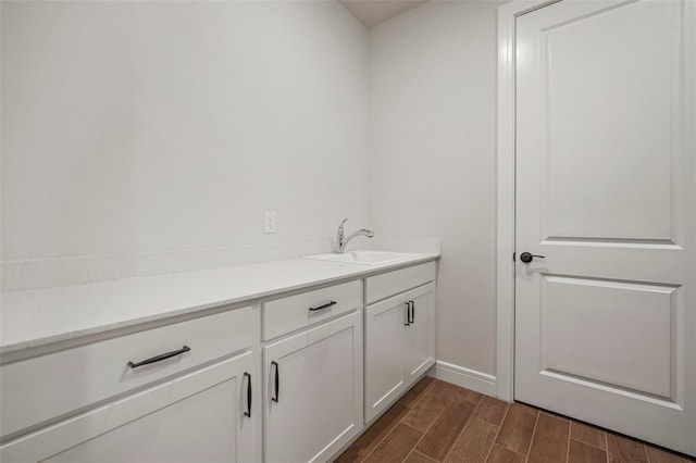 bathroom with hardwood / wood-style flooring and vanity