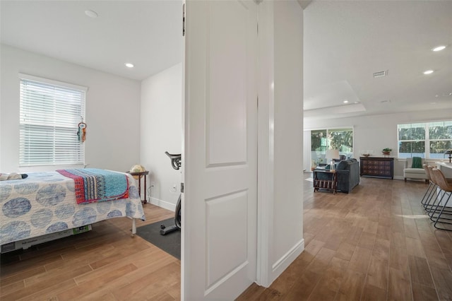 bedroom with hardwood / wood-style flooring