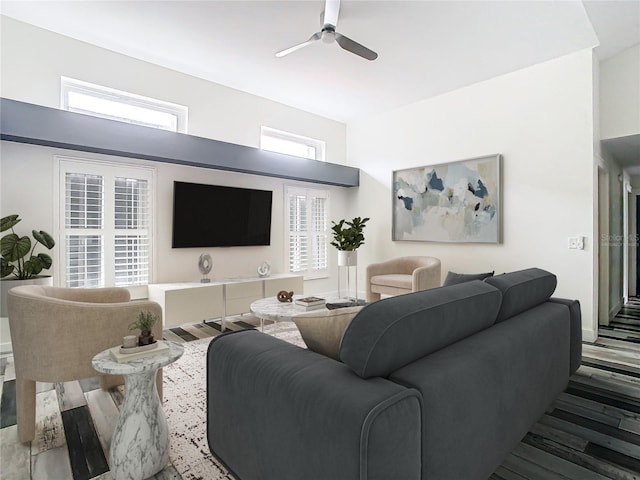 living room with hardwood / wood-style flooring and ceiling fan