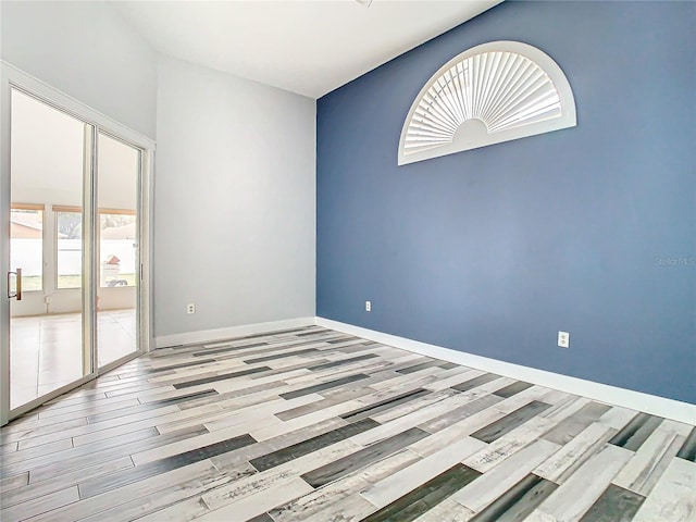 unfurnished room featuring light wood-type flooring