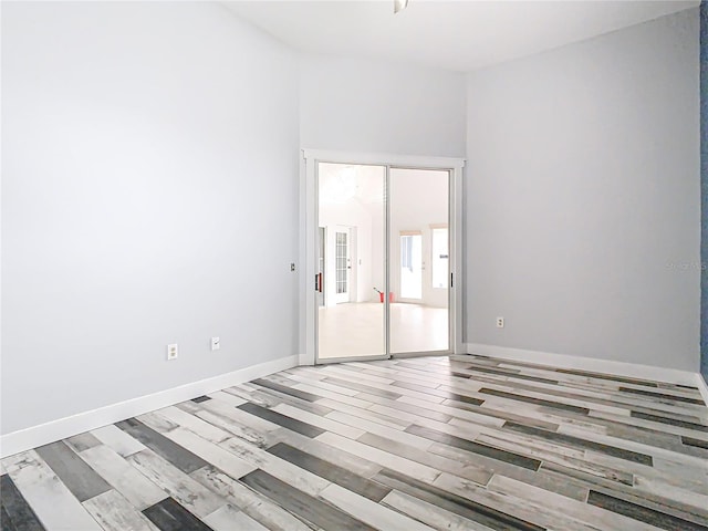 spare room featuring light hardwood / wood-style floors