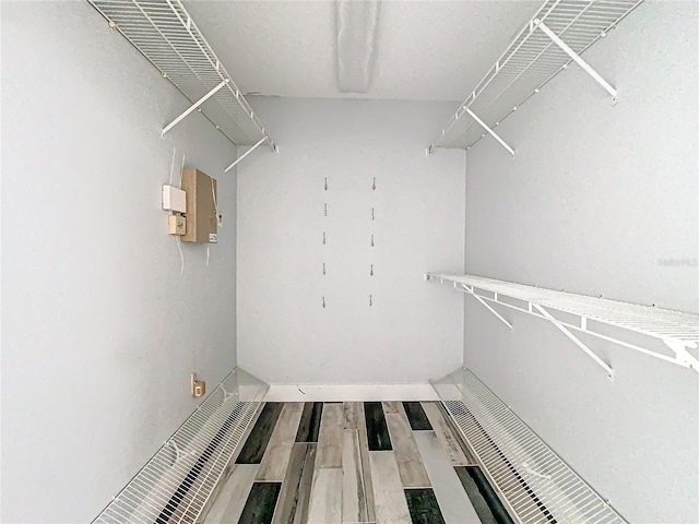 walk in closet featuring wood-type flooring