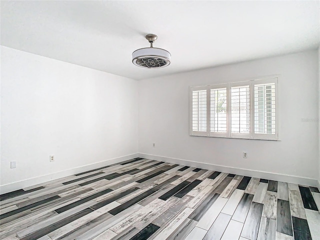 unfurnished room with hardwood / wood-style floors