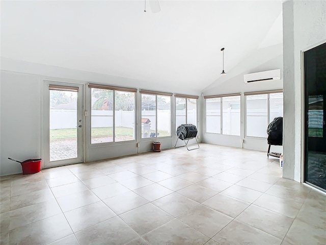 unfurnished sunroom with a wall mounted AC and vaulted ceiling