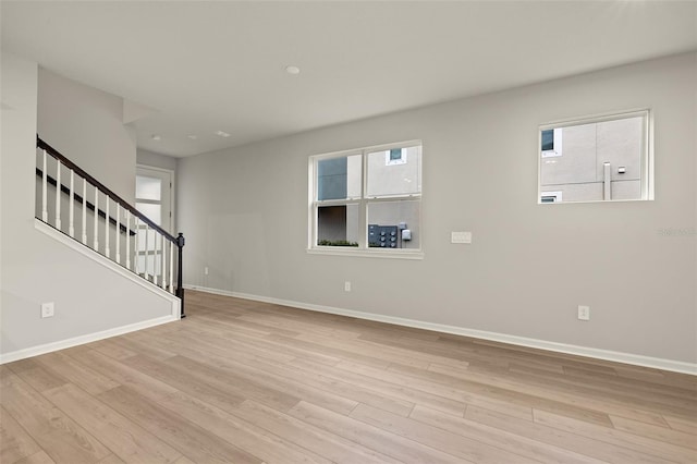 unfurnished living room featuring light hardwood / wood-style flooring