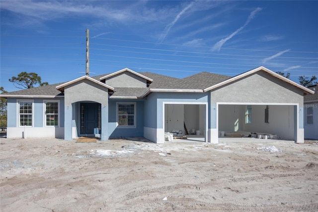 single story home featuring a garage