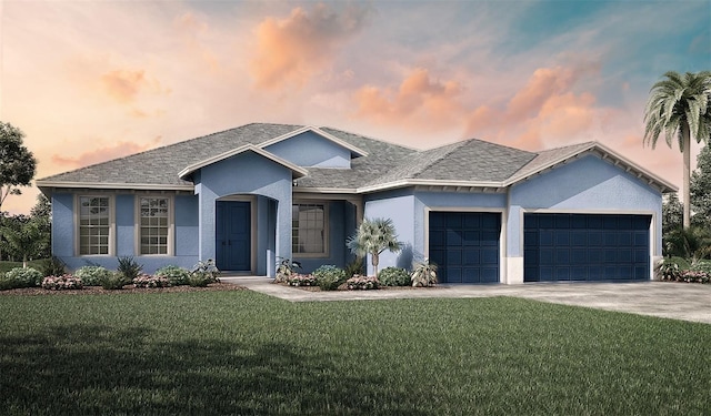 view of front of house featuring a garage and a lawn