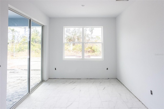 unfurnished room with plenty of natural light