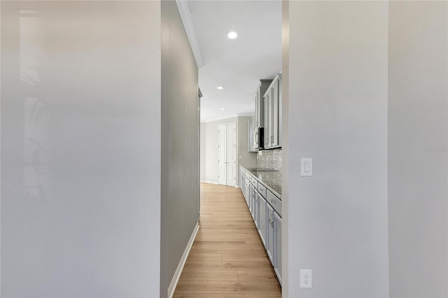 hall with light hardwood / wood-style flooring