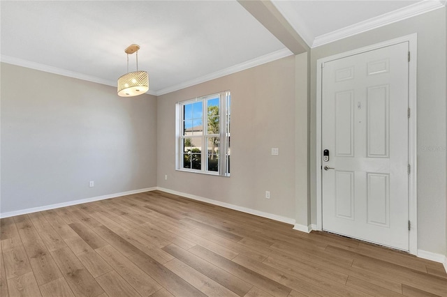 foyer featuring light hardwood / wood-style floors and crown molding