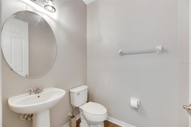 bathroom with toilet and sink