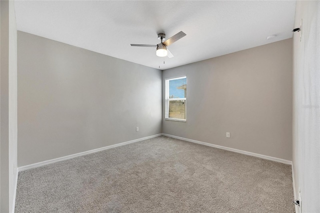 empty room featuring carpet flooring and ceiling fan