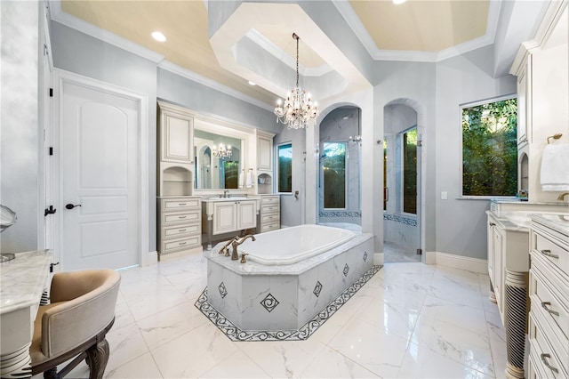 bathroom featuring a wealth of natural light, vanity, independent shower and bath, and a notable chandelier