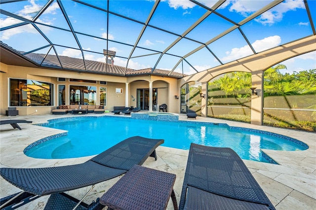 view of pool featuring a lanai, ceiling fan, an in ground hot tub, and a patio