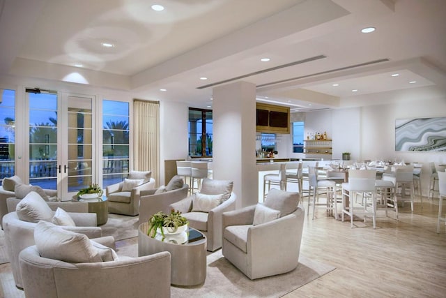 living room featuring french doors and light hardwood / wood-style floors