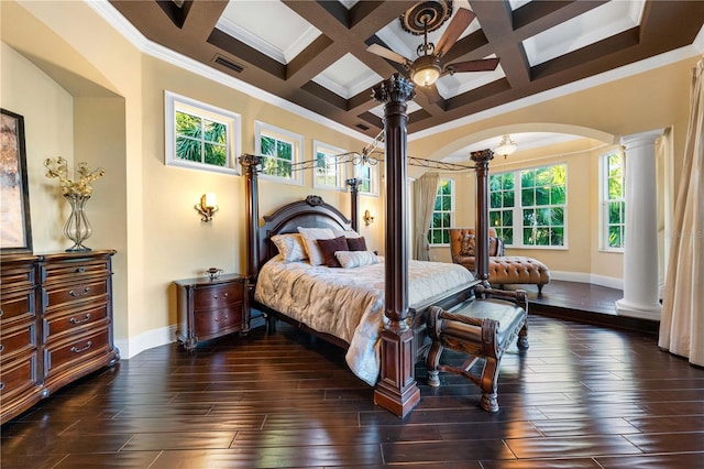 bedroom with ceiling fan, beam ceiling, coffered ceiling, ornamental molding, and decorative columns