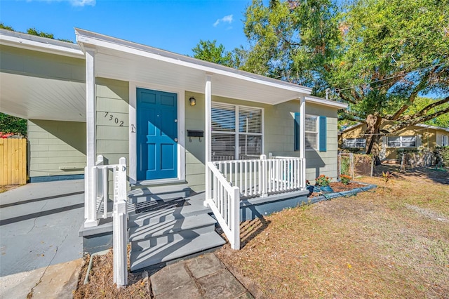 doorway to property featuring covered porch