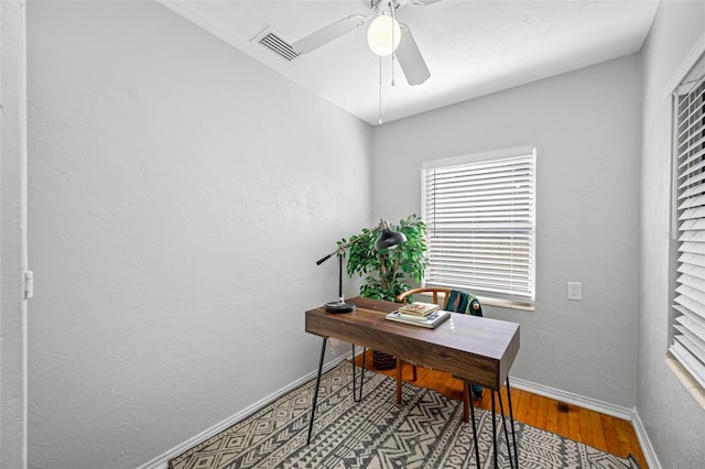 office area with hardwood / wood-style flooring and ceiling fan