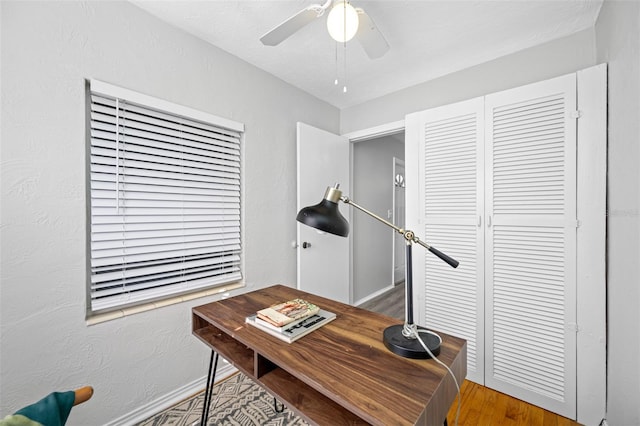 home office with hardwood / wood-style floors