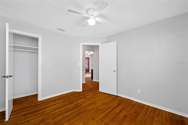 unfurnished bedroom with a closet, ceiling fan, and hardwood / wood-style floors