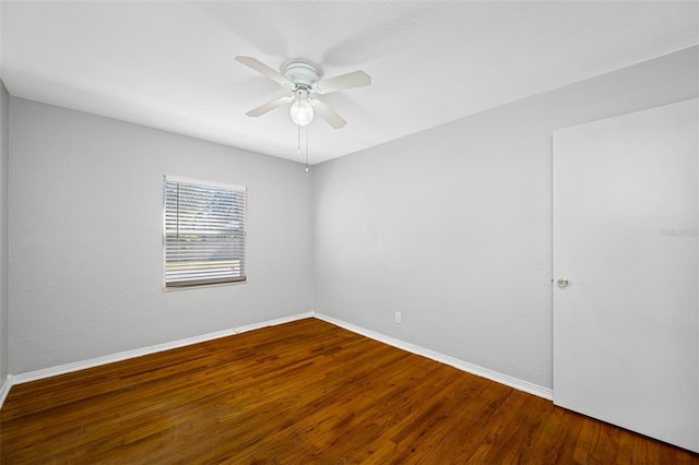 empty room with ceiling fan and wood-type flooring