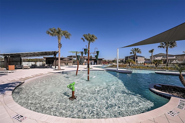 view of swimming pool with a patio area