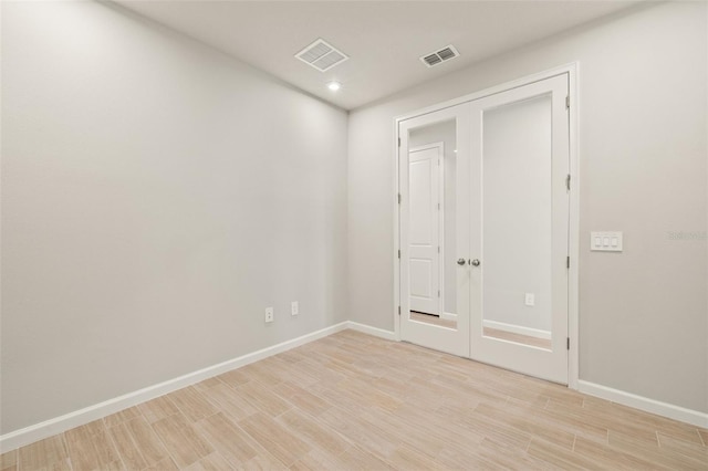 empty room with light hardwood / wood-style floors