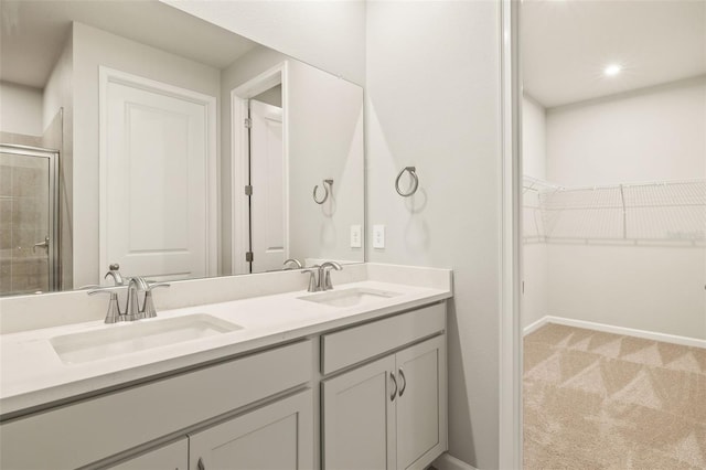 bathroom with vanity and walk in shower