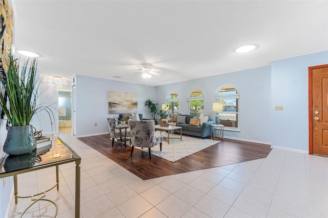 living room featuring ceiling fan and light hardwood / wood-style floors