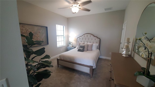 bedroom with ceiling fan and dark carpet