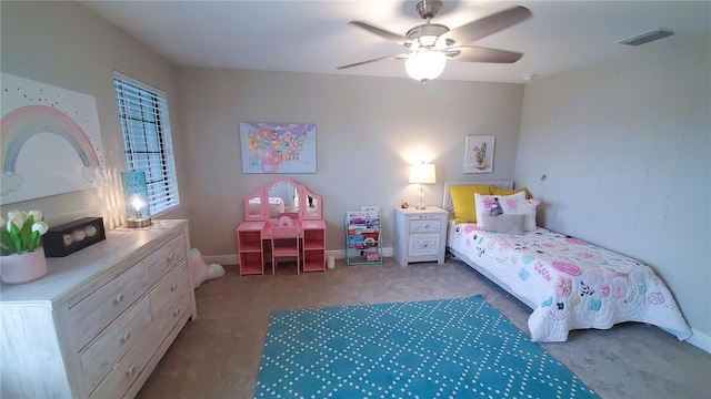 bedroom with ceiling fan and carpet floors