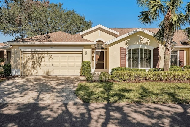 single story home featuring a garage