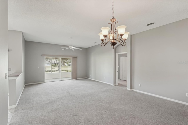 carpeted spare room with a textured ceiling and ceiling fan with notable chandelier